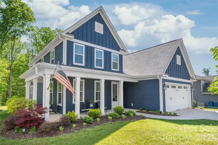 Modern sophistication meets small-town serenity. Featuring a show-stopping wrap-around porch, wooded backyard, and custom feel.