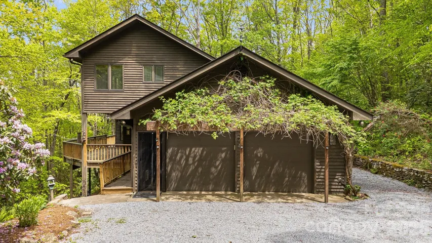 Double garage framed with honeysuckle vines