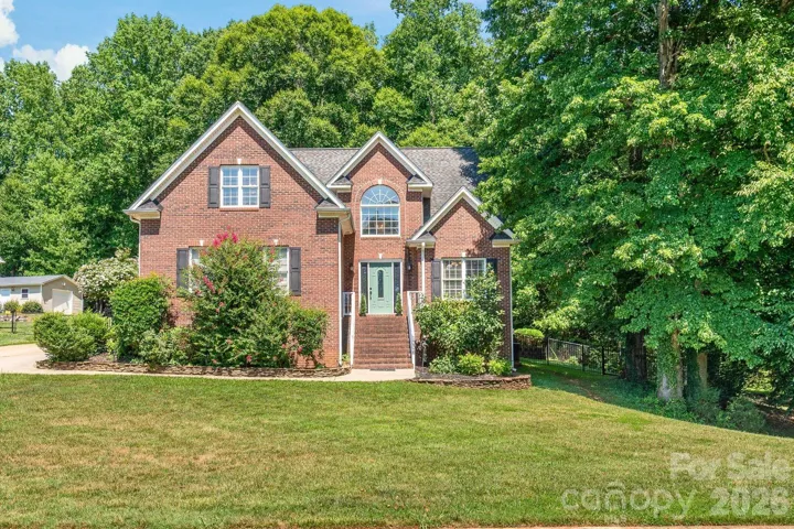 Stunning BRICK Grassy Meadows home on a double lot with a POOL