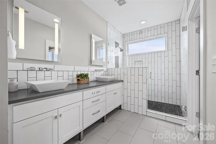 Large walk-in shower with window