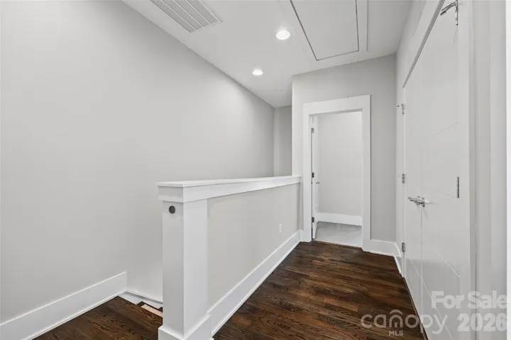 Upper level landing with side by side laundry