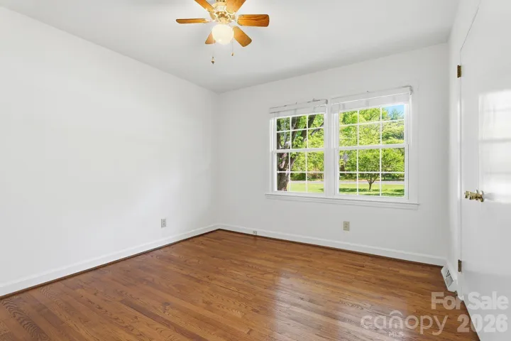 Secondary bedroom facing the front lawn.