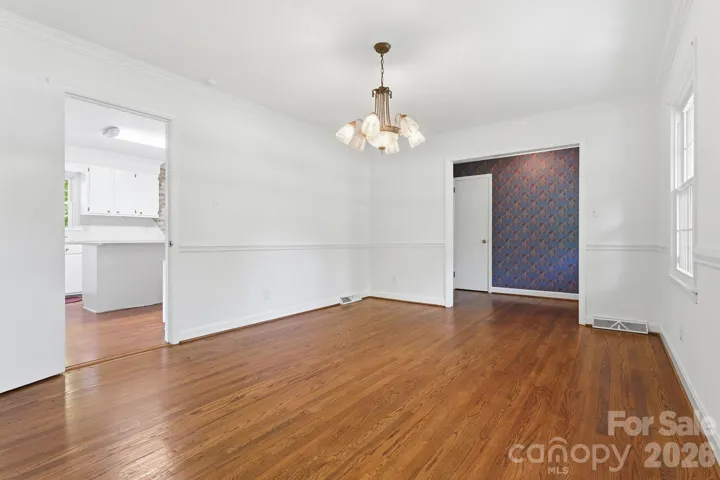 Living room (could be formal dining) with foyer and kitchen access.
