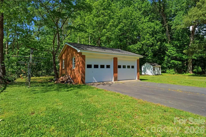 Three sheds and a detached garage gives plenty of space for storage and hobbies.
