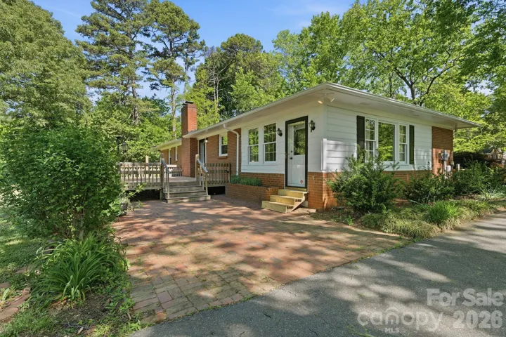 Brick patio and deck offer plenty of outdoor space.