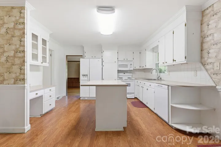 Original kitchen cabinets for your updates or use as is now.  New dishwasher.