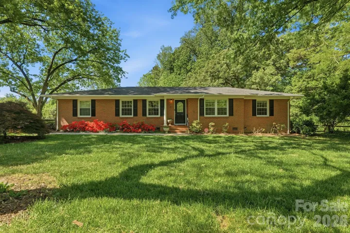 Mid-century ranch situated on a beautiful lot of over 1 acre!