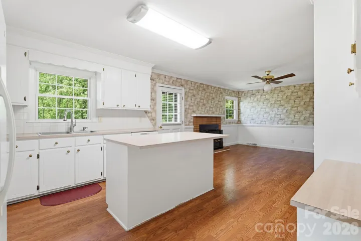 Kitchen is open to great room and door leads to deck.