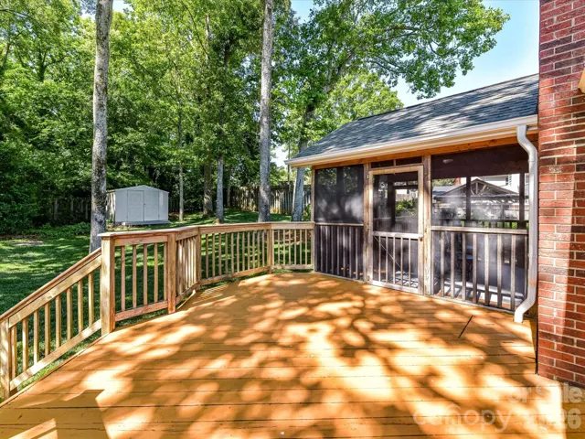 Back deck with view of screened in porch