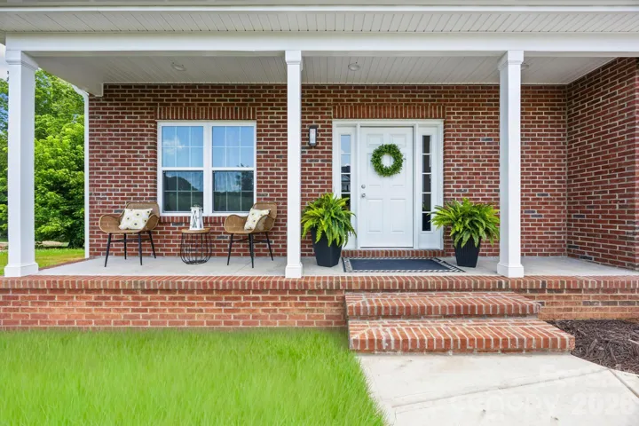 Custom-style brick home on .68 acres ?