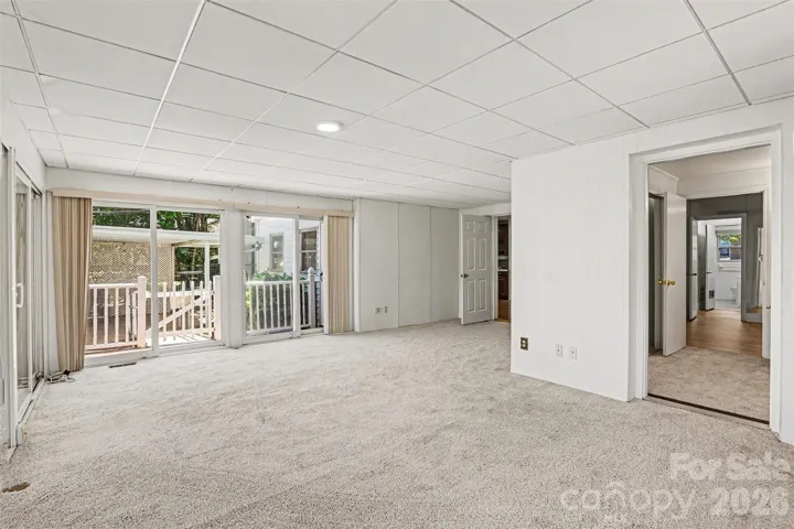 New carpet- this area is perfect for a large primary bedroom with private exterior access from the main house