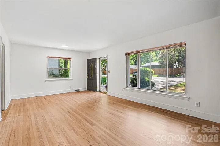 Gorgeous refinished white oak flooring in the family room - Family room has fresh paint and large windows for great natural light