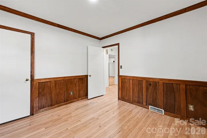 Bedroom two- craftsman style trim/molding, refinished white oak flooring