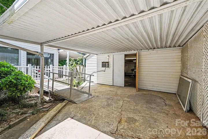 Carport area - there is currently a ramp into the back bedroom area 