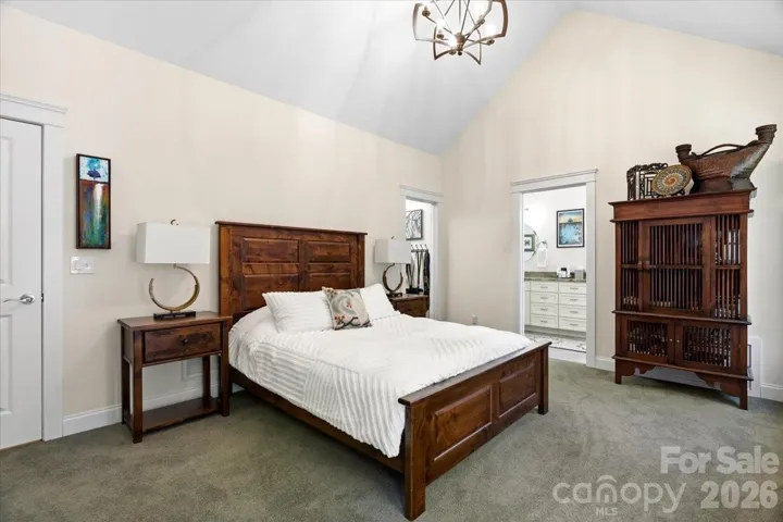 Owner bedroom with vaulted ceiling
