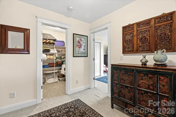 Nice upstairs landing with large walk in sorage closet 