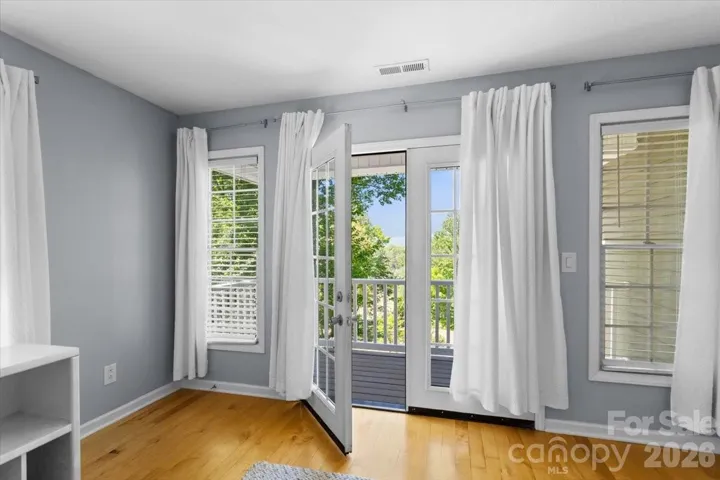 Door to upstairs balcony from bedroom