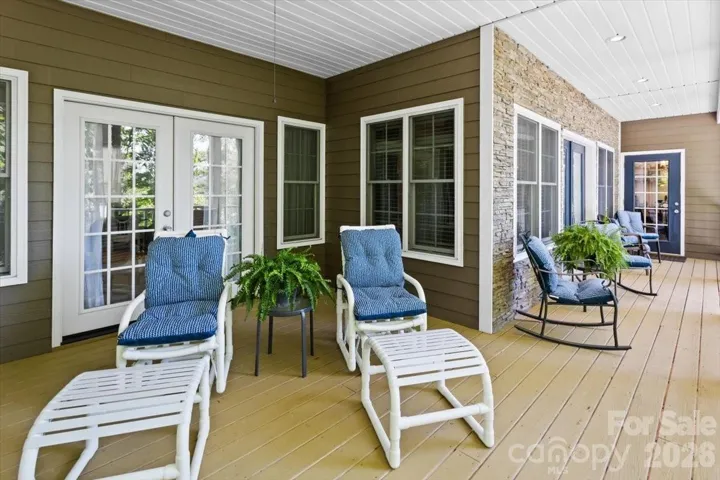 Front deck with doors to downstairs bedroom