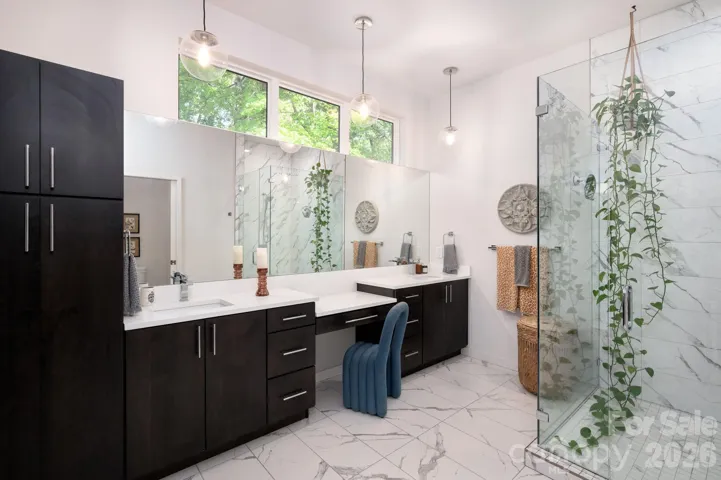 Double vanities with ample storage and counter space.