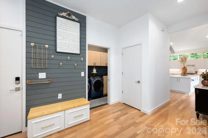 Stylish mudroom with built-in bench, hooks, and storage.