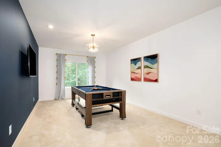 Versatile bonus room perfect for media or game space.