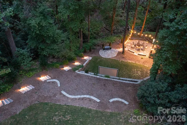 Stone pathways to the fire pit lounge.