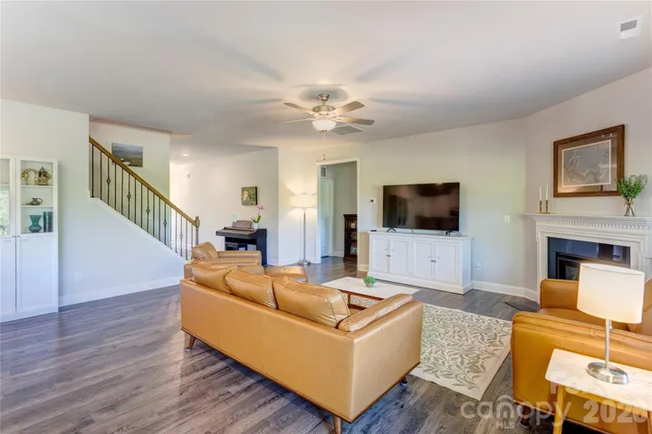 The corner fireplace is the focal point of the family room
