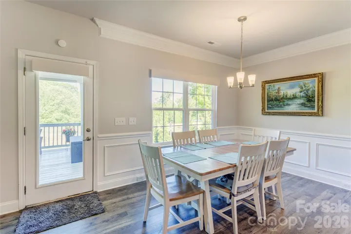 Breakfast room overlooking the covered porch and golf course