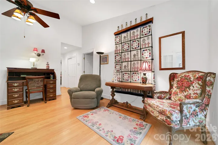 The foyer / entry leads you from the sunroom to the living room with a beautiful wooden floor.