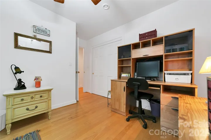 Also on the garage side of the house are three more bedrooms and another full bath. Three bedroom septic system, but actually 4 bedrooms in the house. This fourth bedroom is being used as an office with a bed.