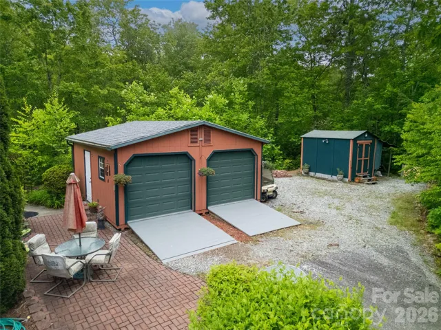 The two-car garage is out the side door of the house. Extra gravel parking and a great outside shed are at the end of the driveway.