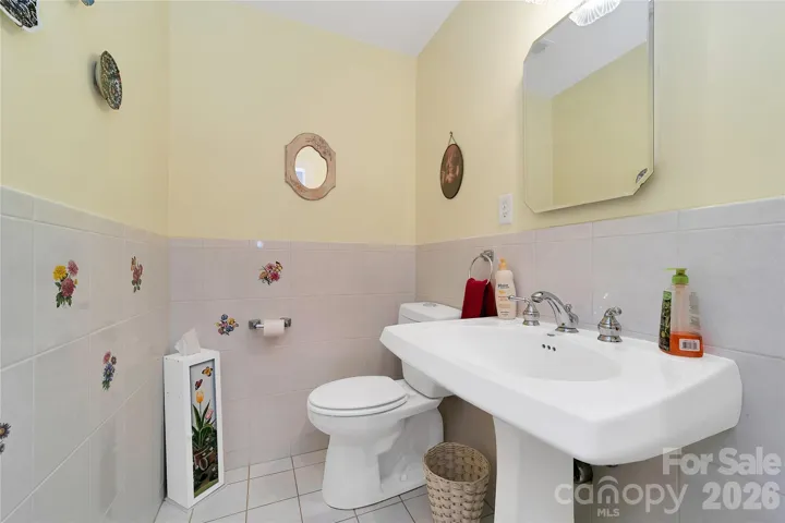 This half bath is just off of the living room on the way to the kitchen.
