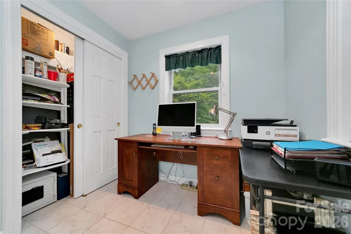 Just beyond the walk-in closet is this convenient room being used as an office by the present owners. Looks out over the fenced side yard.