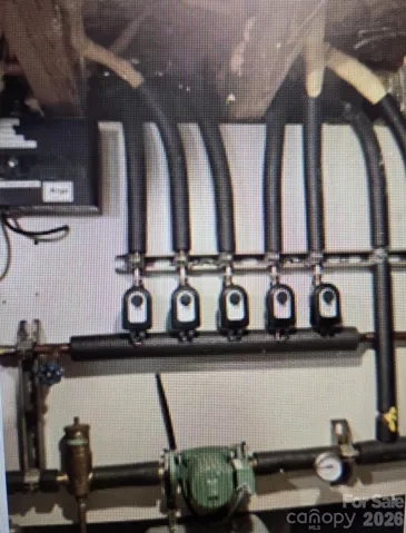 Whole House Radiant Floor Heating System Equipment in Crawlspace