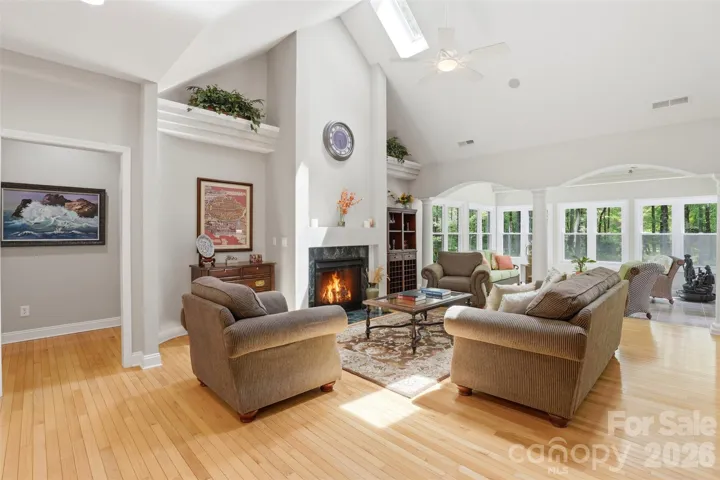 Family room, fireplace, skylights open to sunroom