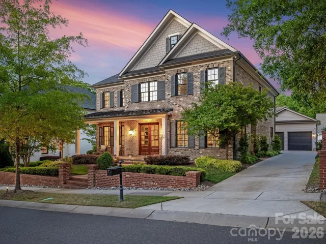 Stately home with sidewalks and gas lamps