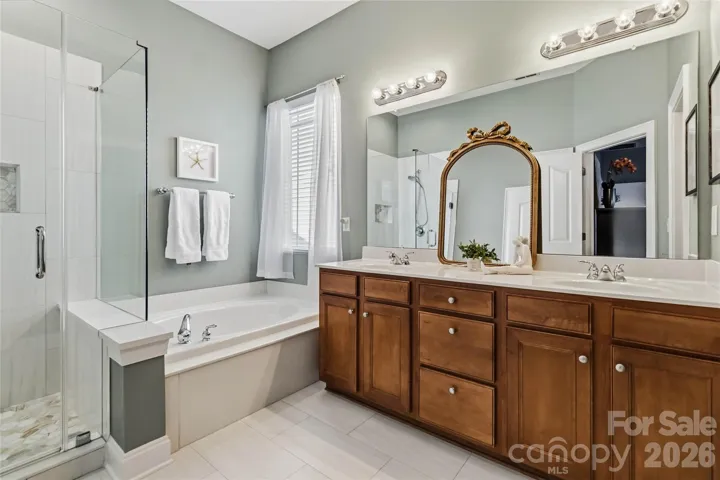 Updated tiled shower with glass enclosure