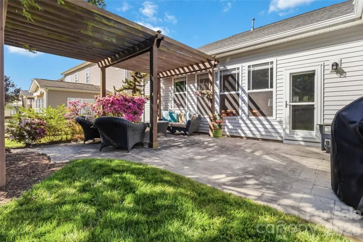 Incredible landscaping with concrete patio