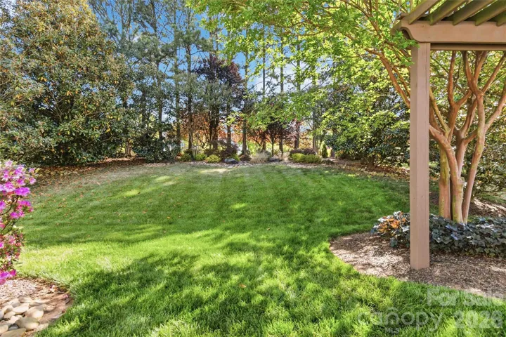 Gorgeously landscaped backyard provides privacy