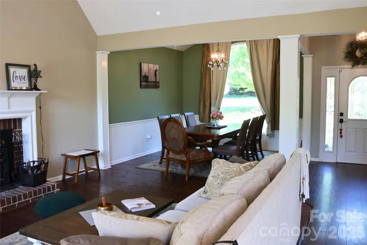 Open Floor Plan, with beautiful dark hardwood floors, flowing into the dining and family room, breakfast and Kitchen areas