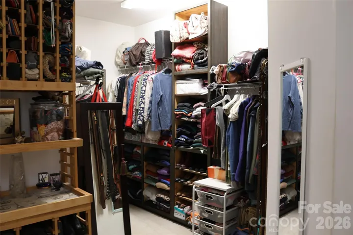 Huge Master Closet with custom shelving, this is one of two sides of the closet