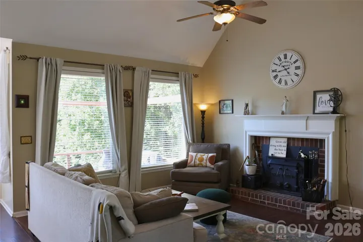 Beautiful Family Room with a cozy fireplace and views of Lake Nixon