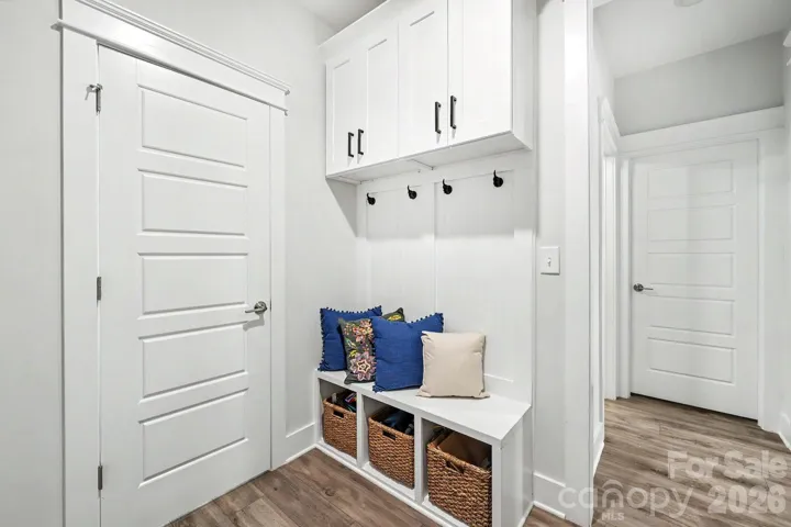 Mudroom entry from the garage with custom cabinetry