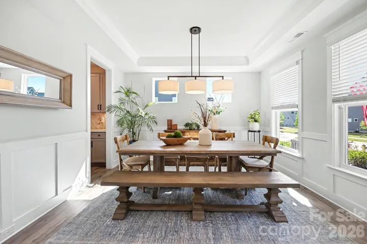 Spacious dining room with tray ceiling