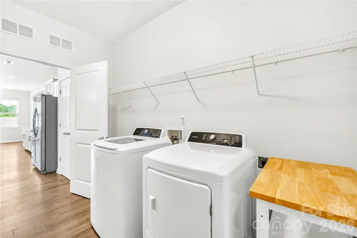 Laundry room has closet and drop zone