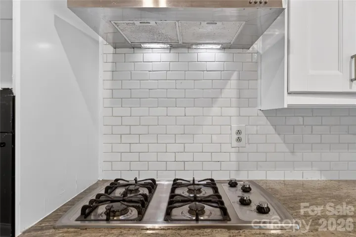Four Burner Gas Cooktop with Exterior Venting Hood