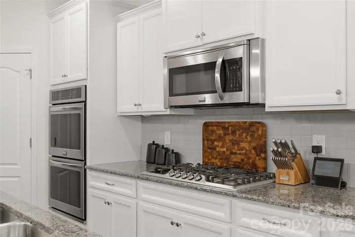 View of double oven and cooktop