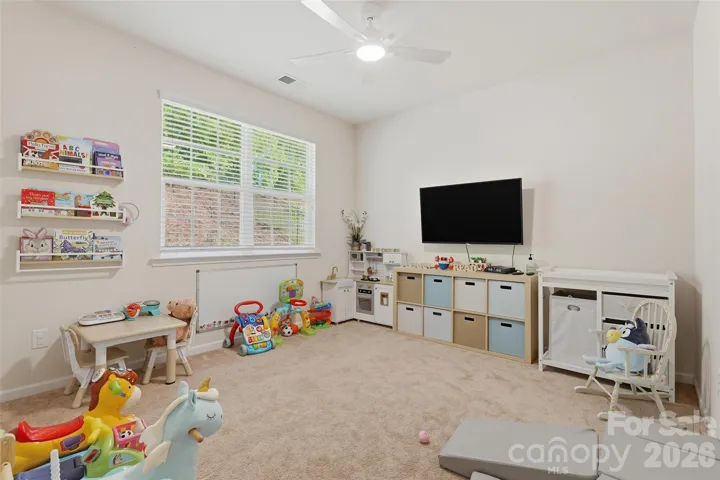 Large bedroom on main level being used as playroom