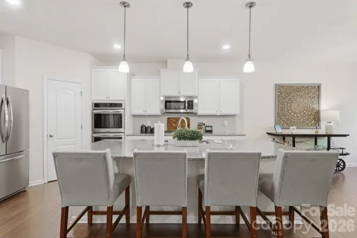 Bright space with recessed and pendant lighting