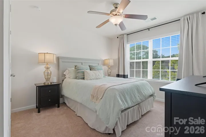 Fourth bedroom on upper level with private full bathroom